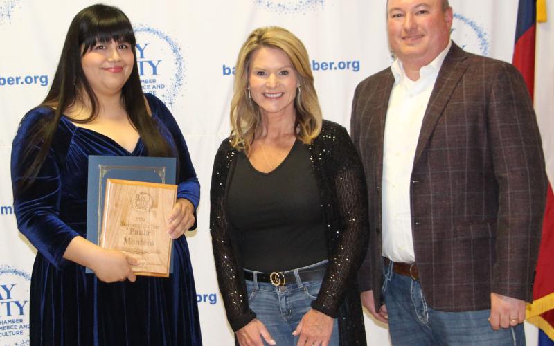 Sentinel Photo/Jessica Shepard Holy Cross Catholic School Teacher of the Year Paula Montero, with Danyel Biggerstaff and MRMC CEO Warrren Robicheaux.