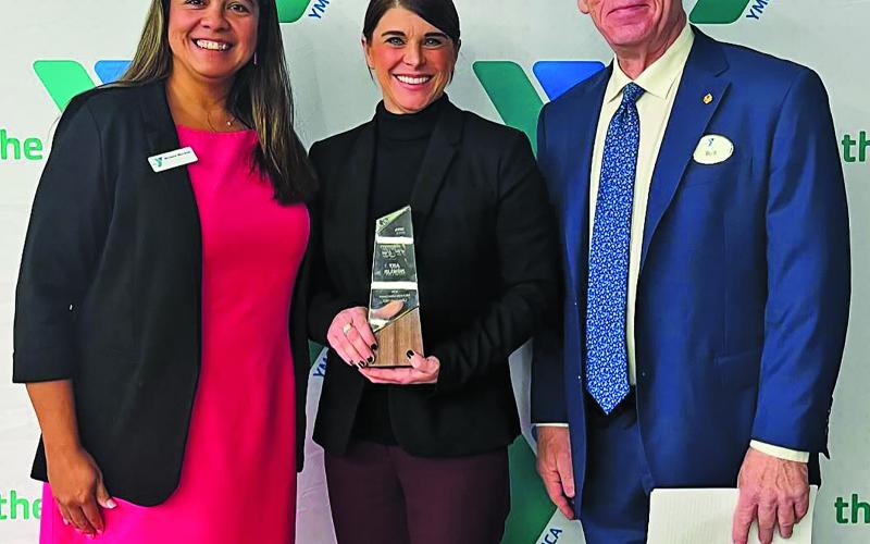 Courtesy photo Matagorda County Coastal &amp; Marine Resources Extension Agent Amy Nowlin, center, was recognized as the Volunteer of the Year by the Calhoun County YMCA for her contributions to the YMCA Palacios Programs on Jan. 23.