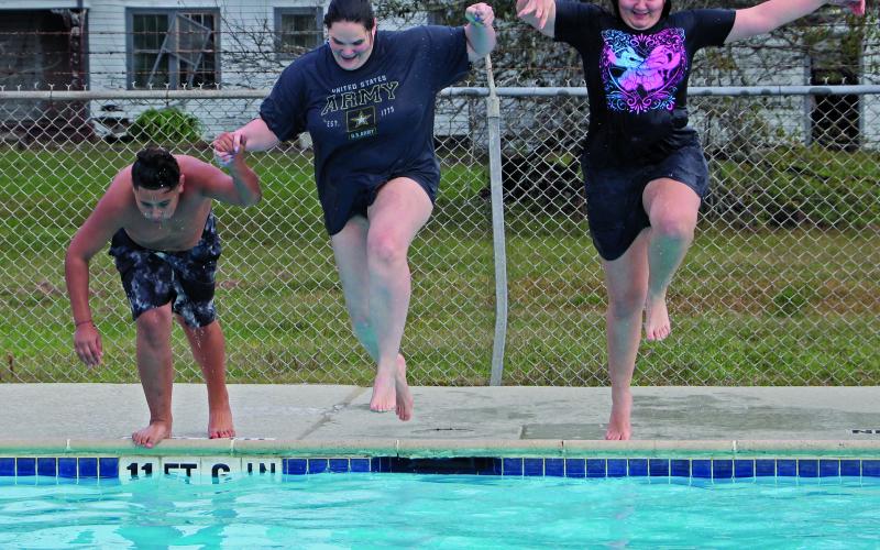 Sentinel Photos/Jessica Shepard This year's "Polar Plunge" featured three brave souls jumping into 64-degree waters at Hilliard Pool, Saturday, Jan. 4.  Interim Parks &amp; Recreation Director Kelly Penewitt said it was the warmest water temperature they have had for the event.