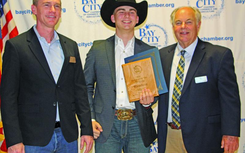 Sentinel Photo/Jessica Shepard Tidehaven ISD Student of the Year Travis Riendeau, center, with Matt Gullett, left, last year’s Chamber Board Chair, and John Dickerson, the 2025 Board Chair.