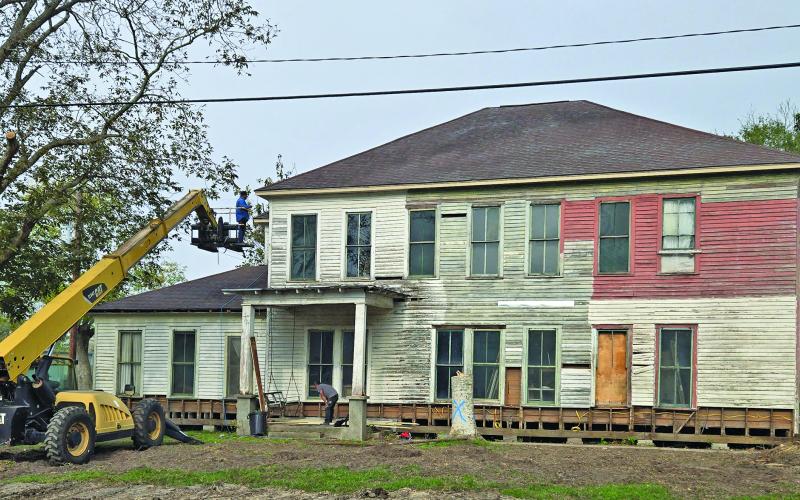 Above, work is on the way to restore the historic Markham-Fisher Hotel.  Sentinel Photo MaLinda Reddell