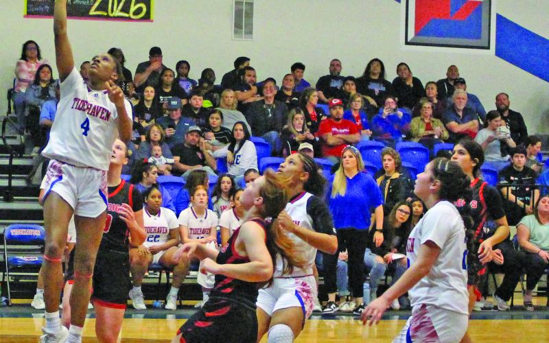Sentinel Photo/Jessica Shepard Tigerette Mary Johnson (4) goes up for a layup.