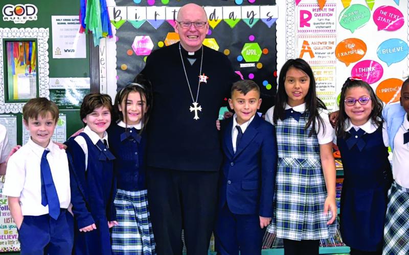 Holy Cross Catholic School photo Bishop Brendan J. Cahill recently made his annual visit to Holy Cross Catholic School to meet and visit 3rd graders. He admired PreK-4 B's coloring pages of the Irish priest Brendan the Navigator of Clonfert - the bishop’s namesake.