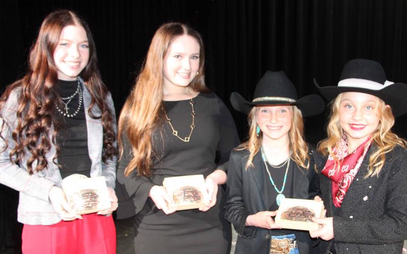 Bay City Sentinel Photo/Jessica Shepard MCFLA's 2025 Public Speaking buckle winners are, from left, Scollie Saha, Taelynn Tinnin, and a first-ever tie with Emma Kubecka and Hayden Joines.