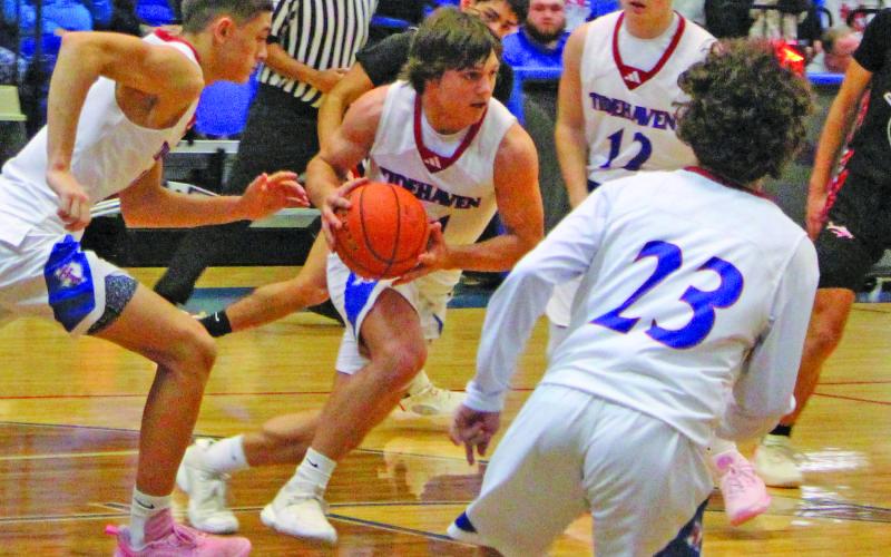 Sentinel Photo/Jessica Shepard Tidehaven’s Justin Griffith (11) heads down court in action against Palacios last Friday, when the Tigers beat the Sharks 59-42.