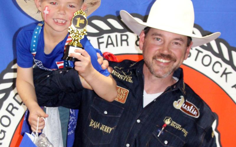Sentinel photo by Jessica Shepard Seven-year-old Banks Busby takes first place in the Matagorda County Fair &amp; Livestock Association's annual "Clown Contest" as chosen by PRCA's Matt Merritt on Saturday, March 8.