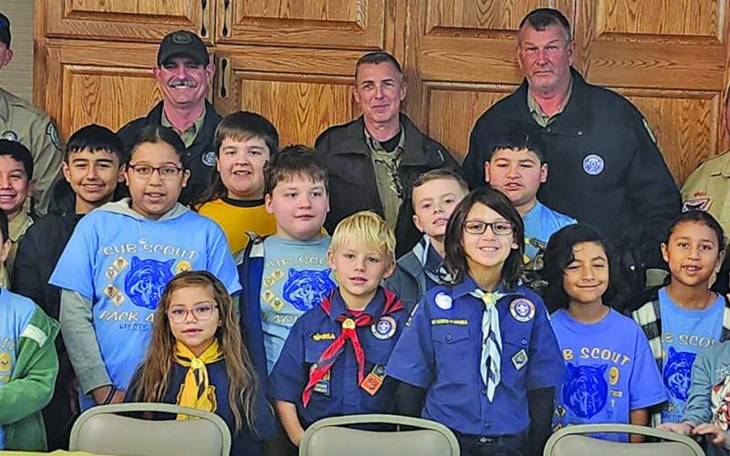 Courtesy photo Cub Scouts - Pack 4545 - held their annual Blue and Gold Picnic at First Methodist Church on Saturday, Feb. 22.  The event’s guest speakers: Deputy Jimmy Hausler and Game Wardens Colten Anderson, Aaron Koenig and David Janseen (Back row).