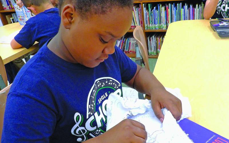 Photo courtesy of Holy Cross Catholic School Holy Cross Catholic School's 4th graders are busy working on their quilt project for this year's annual HCCS Spring Bazaar on April 27.
