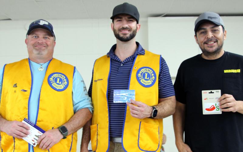 Sentinel Photo/Jessica Shepard : Several adults and teens raced to devour 10 pancakes at the Bay City Lions Club's annual "Pancake Supper" on Thursday, March 27. First through third-place honors went to, from left, John Miller, Ryan Leissner, and Benji Mata.