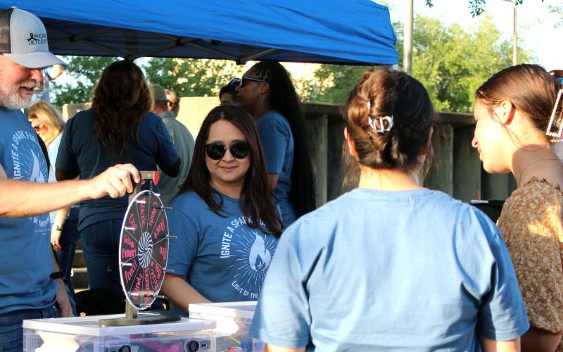 Sentinel Photo/Jessica Shepard The Crisis Center held its “5th Annual Light up the Square” at the Matagorda County Courthouse last Thursday. The event featured food trucks, sexual assault and child abuse awareness information booths, children's activities, and luminaries for remembering county victims of abuse.