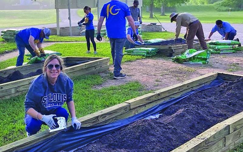 LCRA photo LCRA employees work on the butterfly and wildflower gardens at Riverside Park in Bay City during LCRA’s Steps Forward Day on April 11.