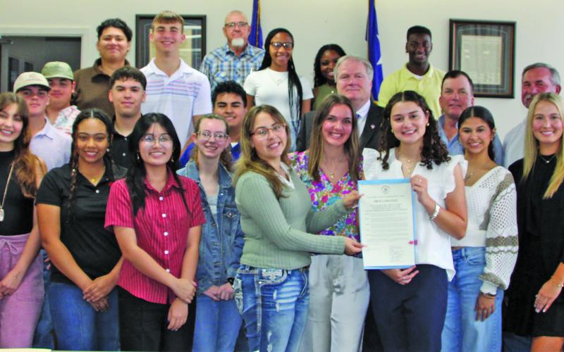 Sentinel Photo/Mike Reddell Commissioners Court proclaimed April 21-25 as National Student Leadership Week for the Youth Leadership Matagorda County Program participants, shown above with Commissioners Court members and sponsor James Outtrim, with HIF USA  Matagorda County.