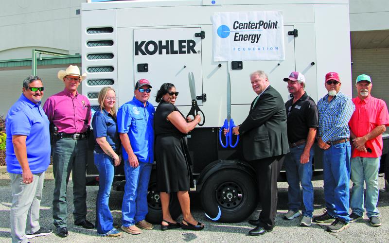 Sentinel Photo/Mike Reddell Matagorda County Commissioners Court, Emergency Management and CenterPoint Energy representatives held a ribbon cutting last for the generator donation.