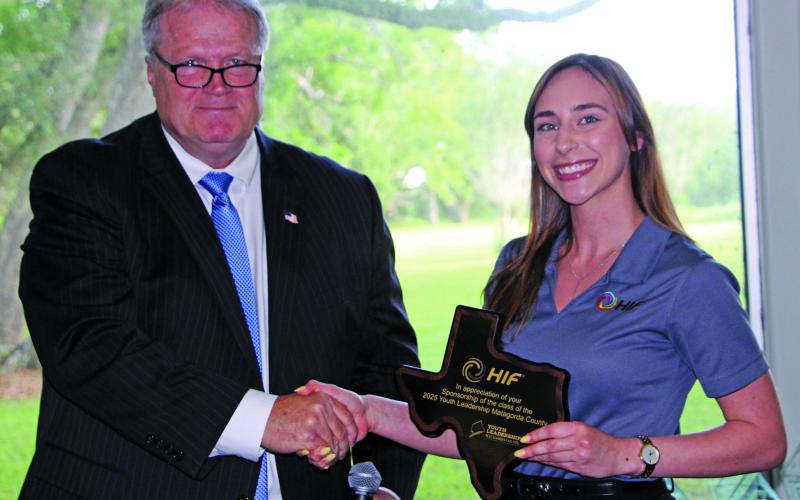Sentinel Photo/Jessica Shepard County Judge Bobby Seiferman presented HIF USA Administrative Assistant Abigail Heisler with a recognition award at the Matagorda County Youth Leadership awards banquet on May 7. The award is for HIF USA’s continued program support for the second year in a row.