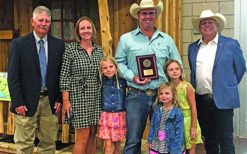 Matagorda County Soil &amp; Water ConservationDistrict #316 Ryan Hickle shows off his Runner Up Award in the Conservation Farmer catgegory for Area 3.