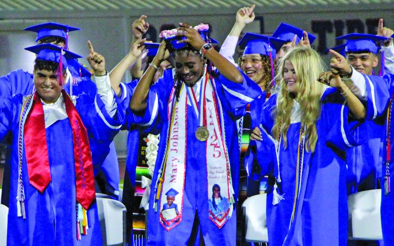 Sentinel Photo/Jessica Shepard Tidehaven High School graduates celebrates at last week’s commencement ceremonies.