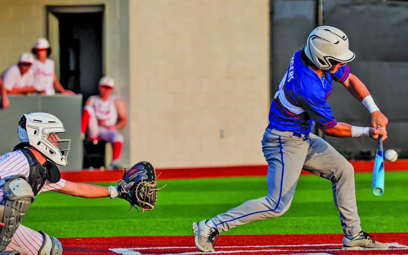 Migasproductions photo A Tidehaven batter steps up for a hit against Palacios in last week’s game.