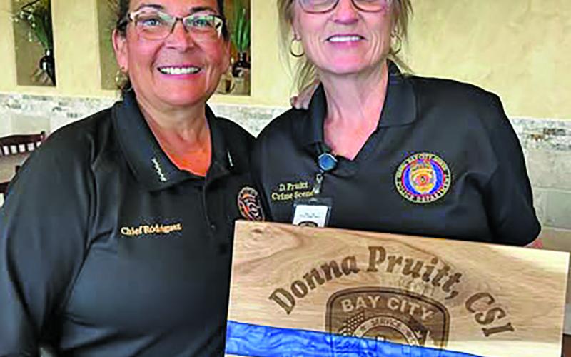 Bay City Police Departmetn celebrated the retirement of  Donna Pruitt, CSI, left, with Police Chief Christella Rodriguez. “Her hard work and dedication were definitely defining factors of her tenured career here at BCPD,” the chief said. Contributed photo