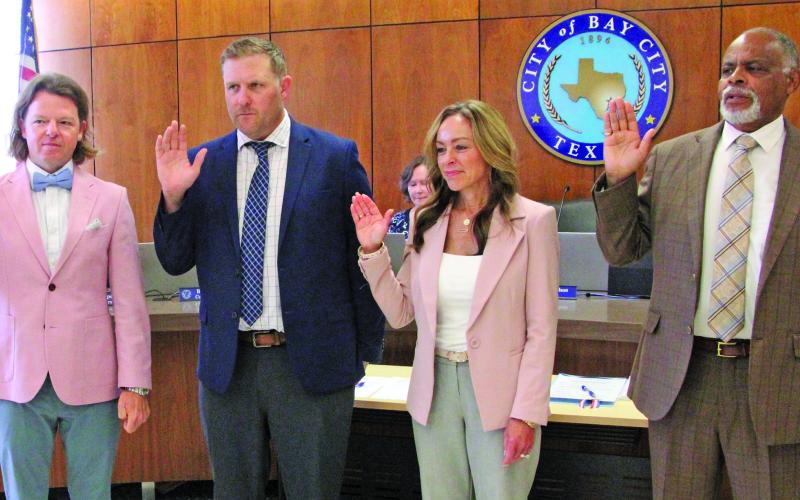 Sentinel Photo/Mike Reddell City Council members are sworn in last week following the May 3 election. Shown, from left, Council Members Bradley Westmoreland, Blayne Finlay, Susan Reardon and Mayor Robert Nelson.