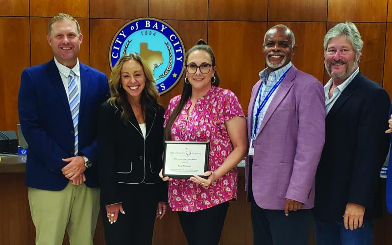 Sentinel Photo/Jessica Shepard Municipal Court Administrator Katie Plunket, center, was recognized for her Texas Municipal League "Leadership Fellow" certification at the city council meeting last Tuesday, July 8.