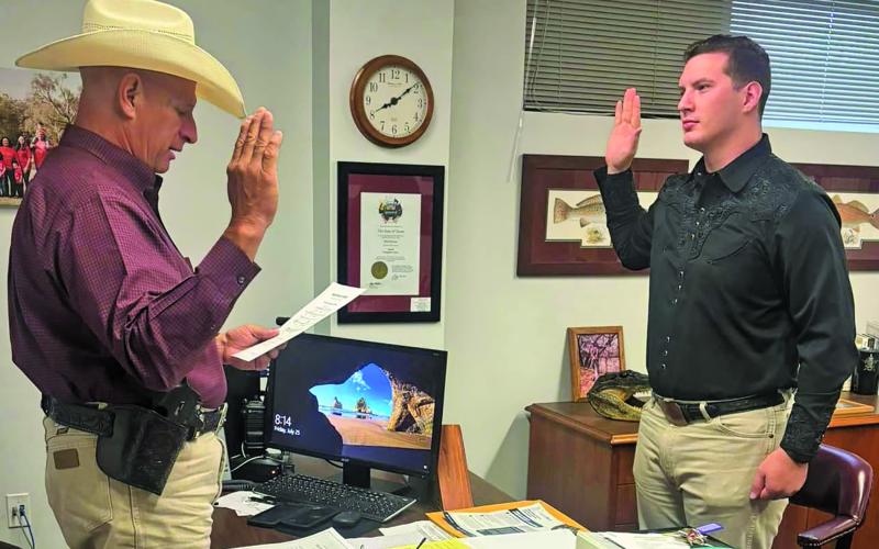 Courtesy photo Sheriff Rick DeLeon swears in Deputy Matthew Kitchens to the Sheriff’s Office. Kitchens graduated from the Alvin Community College Law Enforcement Academy this month. Kitchens is an Army veteran, husband and father.