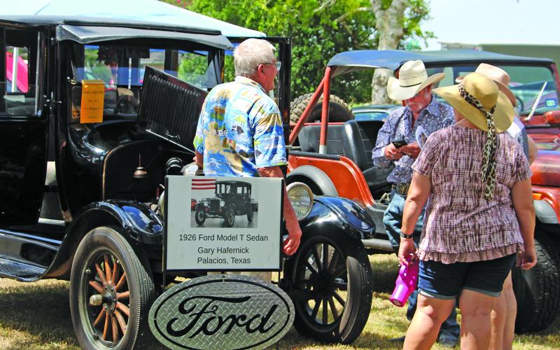 Sentinel Photo/Jessica Shepard The Hotel Blessing car show also featured 10 youngsters who participated with their electric and gas-powered vehicles. Above, Gary Hafernick from Palacios brought his 1926 Ford Model T Sedan. Below, an array of cars drew the interest from visitors.