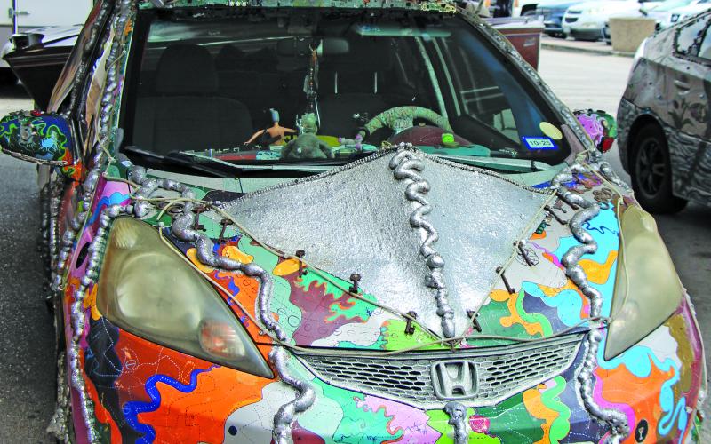 Sentinel Photo/Jessica Shepard One of the features at "Matagorda County ArtWalks: Summer Blues" event last Saturday. was three cars by Houston Art Car Klub. The one above has the unusual license plate of Map of Space &amp; Time.