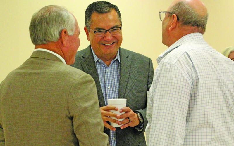 Sentinel Photo/Jessica Shepard Chuck Kharrl (center) laughs with Mitch Thames, left, and George Harrison.