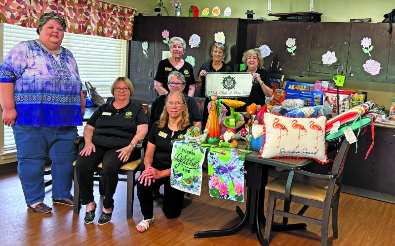 Contributed photo Pilot Club of Bay City members show off the items donated to Colonial Living and Rehabilitation Center Memory Unit.