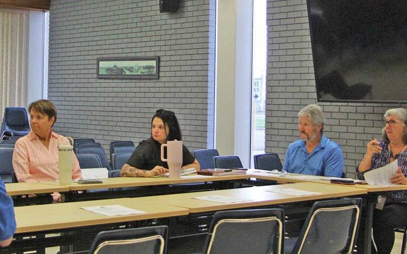 Sentinel Photo/Jessica Shepard City Engineering Technician Gabriel Lopez, right, presents a reimbursement request for a Cottonwood Park topographical survey at TIRZ #1 board meeting on Thursday, Aug. 21.