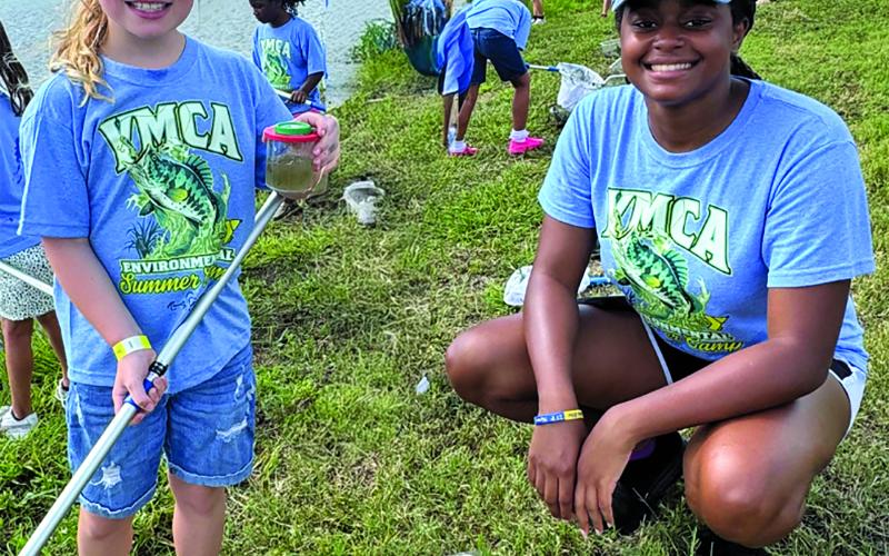 Contributed photo Sea Grant intern Trinity Jones is shown helping YMCA campers this summer.