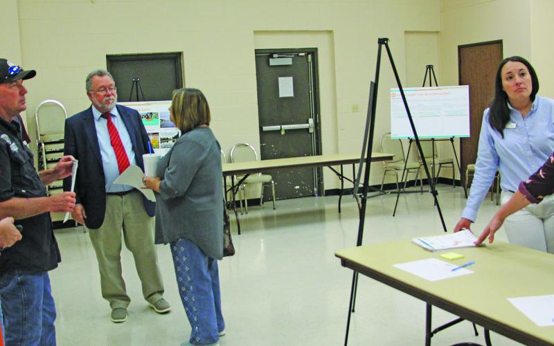 Sentinel Photo/Jessica Shepard Halff Senior Resilience Planner Melissa Beaudry, far right, talks with Bay City Community Development Corporation Executive Director Jessica Russell, far left, and Precinct 2 Commissioner Mike Estlinbaum.