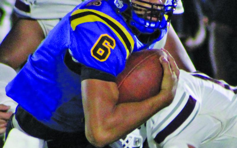 Sentinel Photo/Mike Reddell Blackcat junior Jonus Edwards (6) looks ahead after freeing himselft from Columbia defenders.