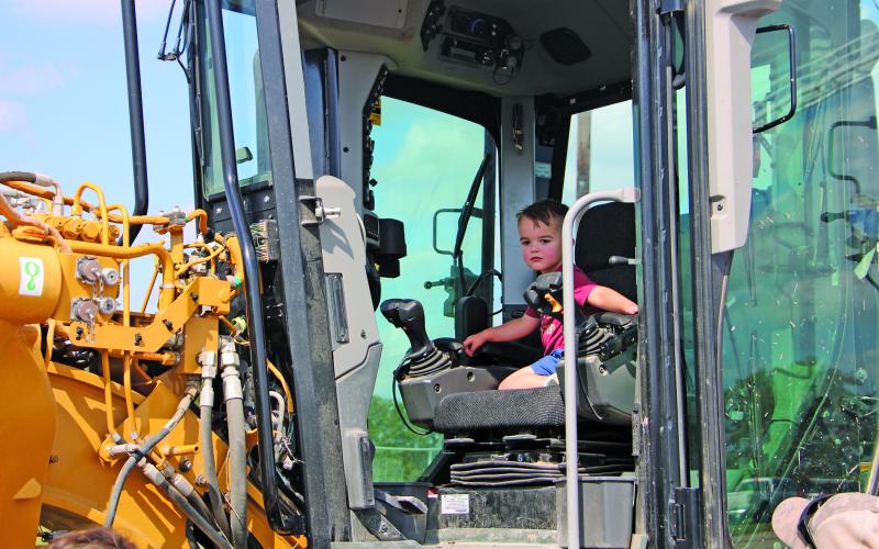A little boy looks out from the cab of a road grader at the Parks &amp; Recreation Department’s annual Touch-A-Truck event at the Sports Complex Saturday, Feb.13. Parents let their children get into the cabs of different machines - under close supervision. Sentinel Photo/Mike Reddell