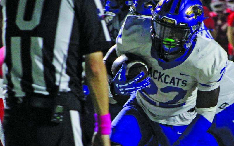 Sentinel Photo/Mike Reddell Senior back James Copeland (22) scores for Bay City, in front of an official.