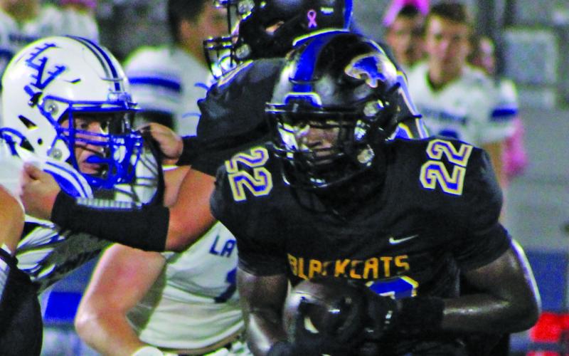 Sentinel Photo/Mike Reddell Senior back James Copeland  (22) rounds the corner for a gain against La Vernia Friday night.