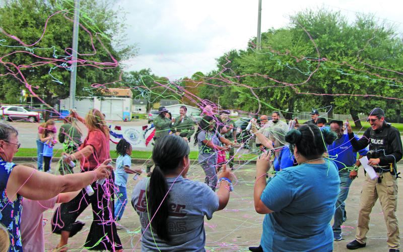 Sentinel Photo/Mike Reddell Bay City Police Department joined in a fun exchange of Silly String last week at the National Night Out at Bay City Library. Lots of city officials, BCISD officers and other agencies were part of this annual event. This part of National Night Out in Bay City - there were events at other Bay City  locations - were made possible “thanks to everyone who hosted, organized, and joined us,” said Police Chief Christella Rodriguez.