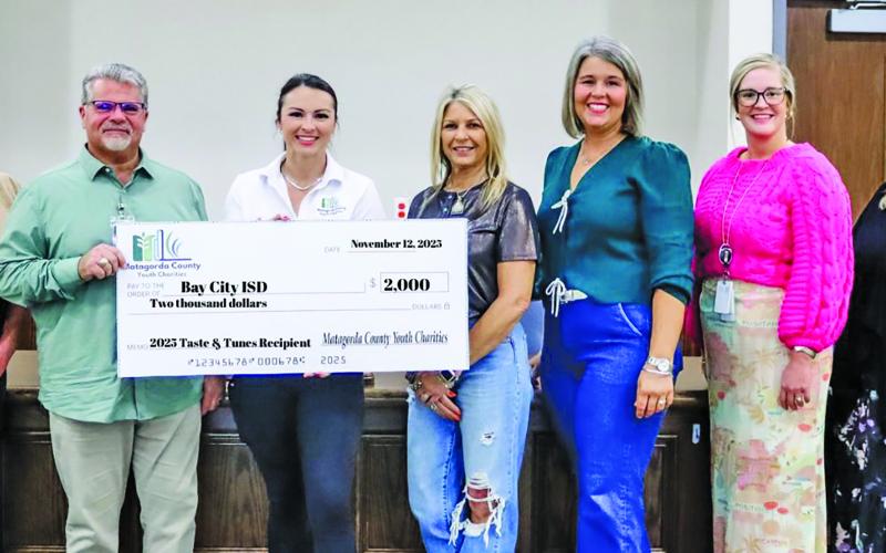 Contributed photo Matagorda County Youth Charities presented a $2,000 donation check to Bay City ISD on Nov. 12.