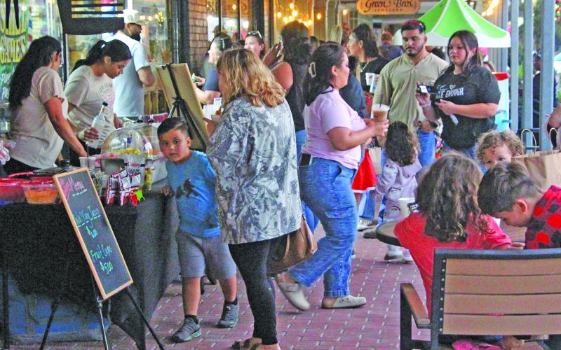 Sentinel Photo/Jessica Shepard Bay City Main Street Program's annual "Christmas Around the Square" returned to downtown on Thursday, Nov. 20. Local businesses and organizations were full of Christmas cheer and drew quite the crowd during the event.