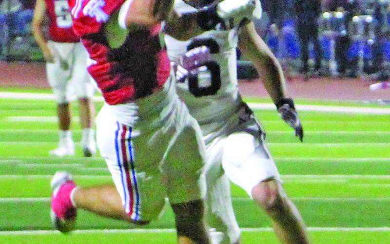Sentinel Photo/Jessica Shepard Senior wide receiver Boogie Galvan (4) pulls in a pass against the Brahmas last Friday night. Galvan had 202 receiving yards and four touchdowns to pace the Tigers.
