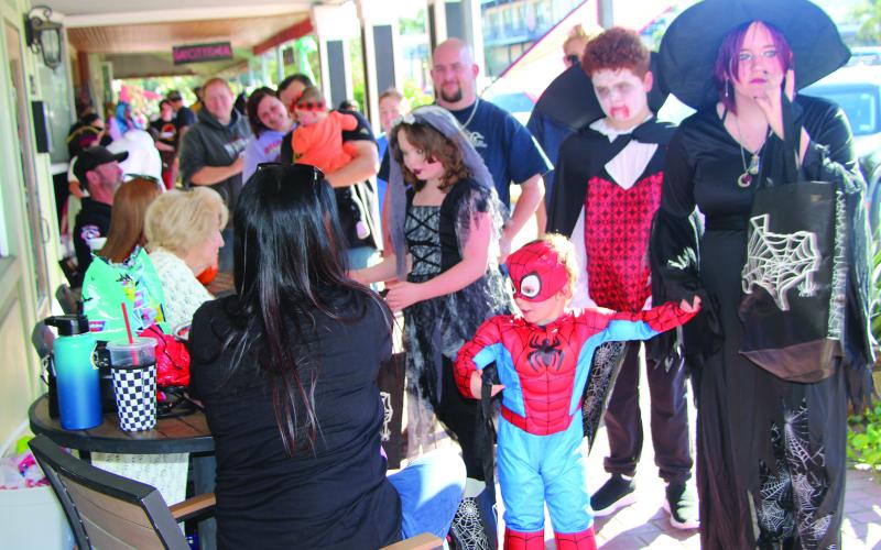 Sentinel Photo/Jessica Shepard Halloween brought scores of trick-or-treaters to downtown last Thursday. Above, a few of the youngsters’ costumes on display.