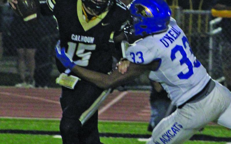 Sentinel Photo/Mike Reddell Senior defensive end Jordan O’neal  (33)  gets a grip on the Calhoun quarterback in Friday’s game.
