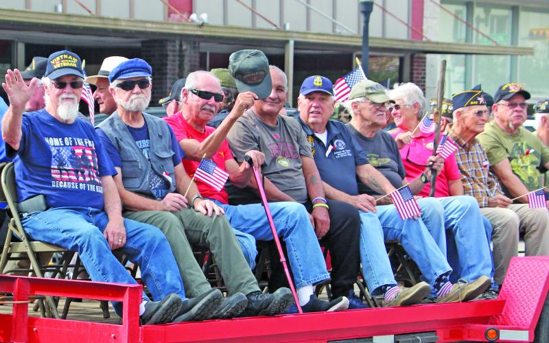 Sentinel Photo/Jessica Shepard Several parade trailers and vehicles, like above right, chauffeured local veterans downtown last Saturday. After the parade, veterans and their families were treated to a special brunch at the Bay City USO Service Center.
