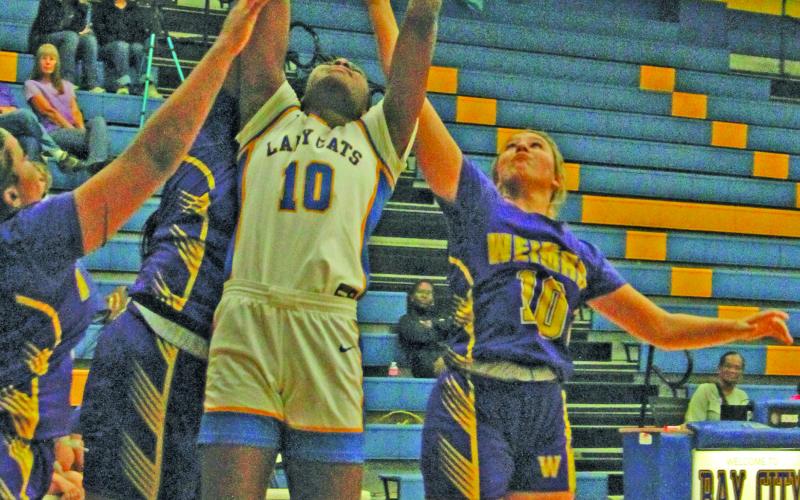 Photo/Anna Hernandez Lady Cat Sasha Onwacheckwa (10) goes up for a rebound during Bay City’s game with Weimer Nov. 18.