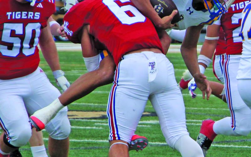 Sentinel Photo/Jessica Shepard Tidehaven’s Bryce Sliva (6) lifts a Blanco running back off the ground for a rather decisive tackle.