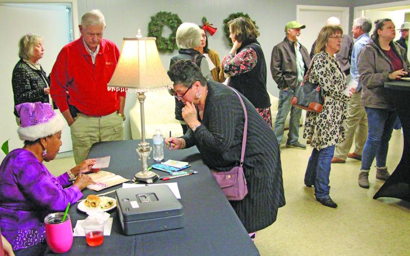 Sentinel Photo/Jessica Shepard New and returning Community Actors of South Texas (CAST) patrons sign up for the 2026 production season during CAST's 'Premiere Night' event Dec. 2.