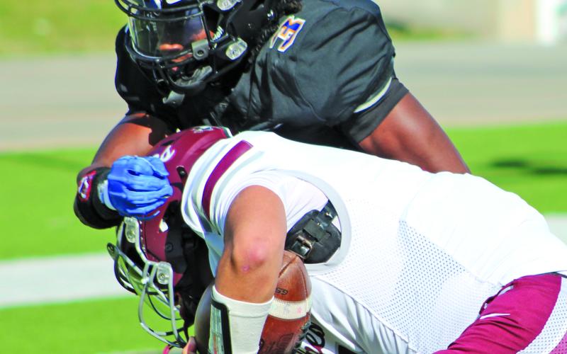 Sentinel Photo/Mike Reddell Braden Jones (3) gets a hold of a Davonport running back.