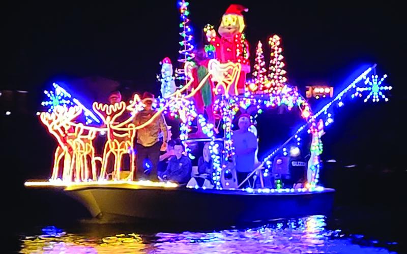 Photo/Bill Orton The Sargent Boat Parade had several entries and lots of appreciative residents watching along the Caney Saturday night.