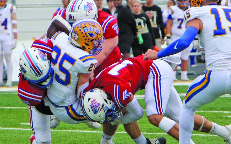 Sentinel Photo/Jessica Shepard A trio of Tidehaven defenders converge on a Blanco running back for a decisive stop in last Friday’s game.
