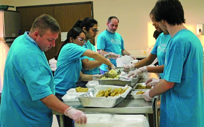 Sentinel Photo/Jessica Shepard Volunteers prepare to-go dinner plates at The Crisis Center's "18th Annual Chicken Fried Steak Dinner" fundraiser on Friday, Jan. 16.